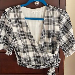 Tularosa wrap top  black and white ruffle sleeve